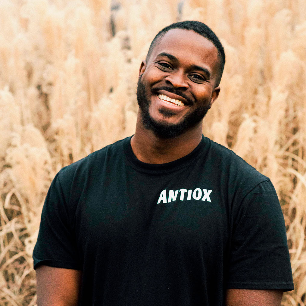 Dr. Marlon Ming smiling in an ANTIOX shirt