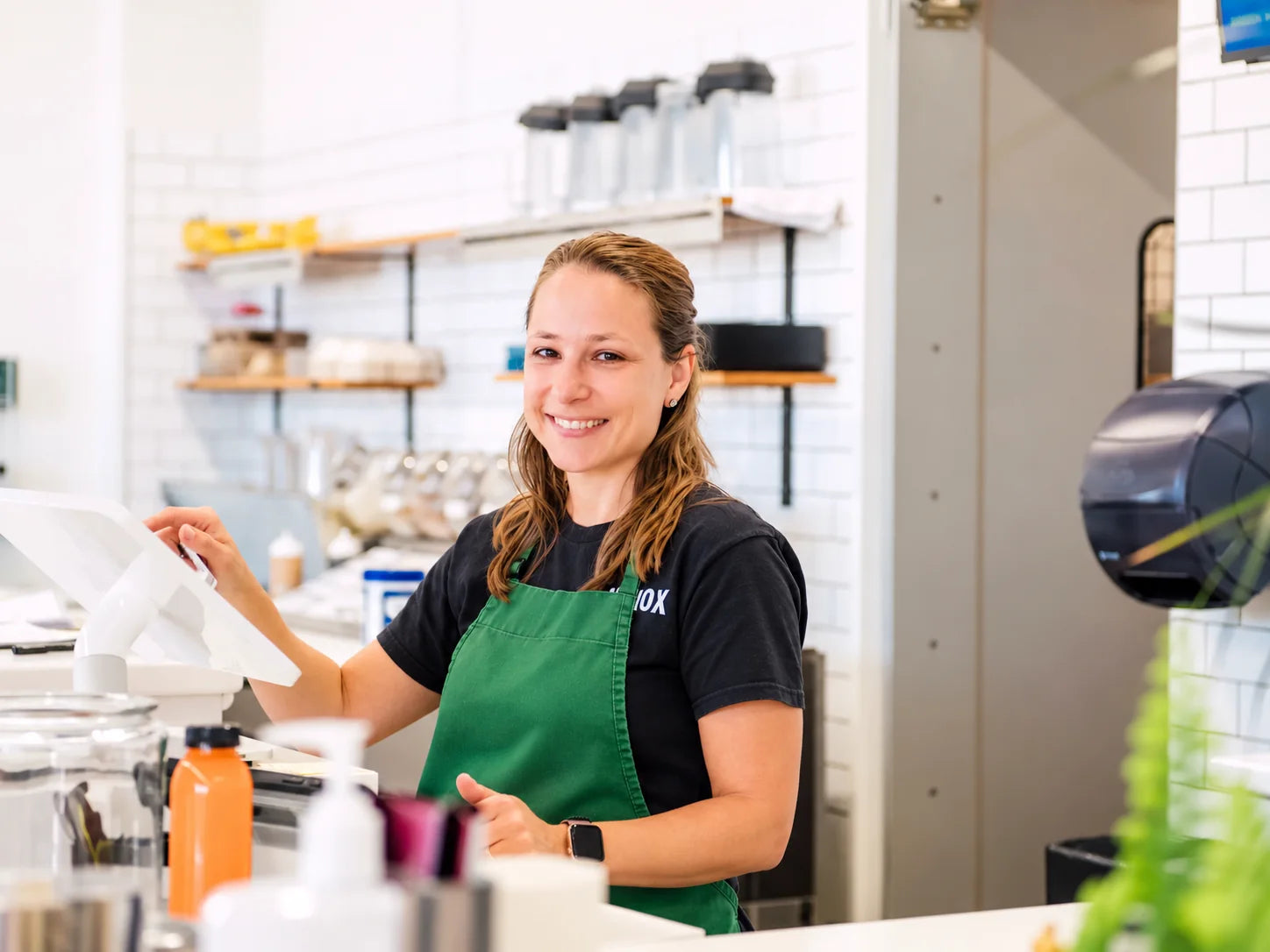 Casey smiling at the ANTIOX juice-bar counter in Hagerstown